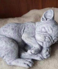 Laying dog statue